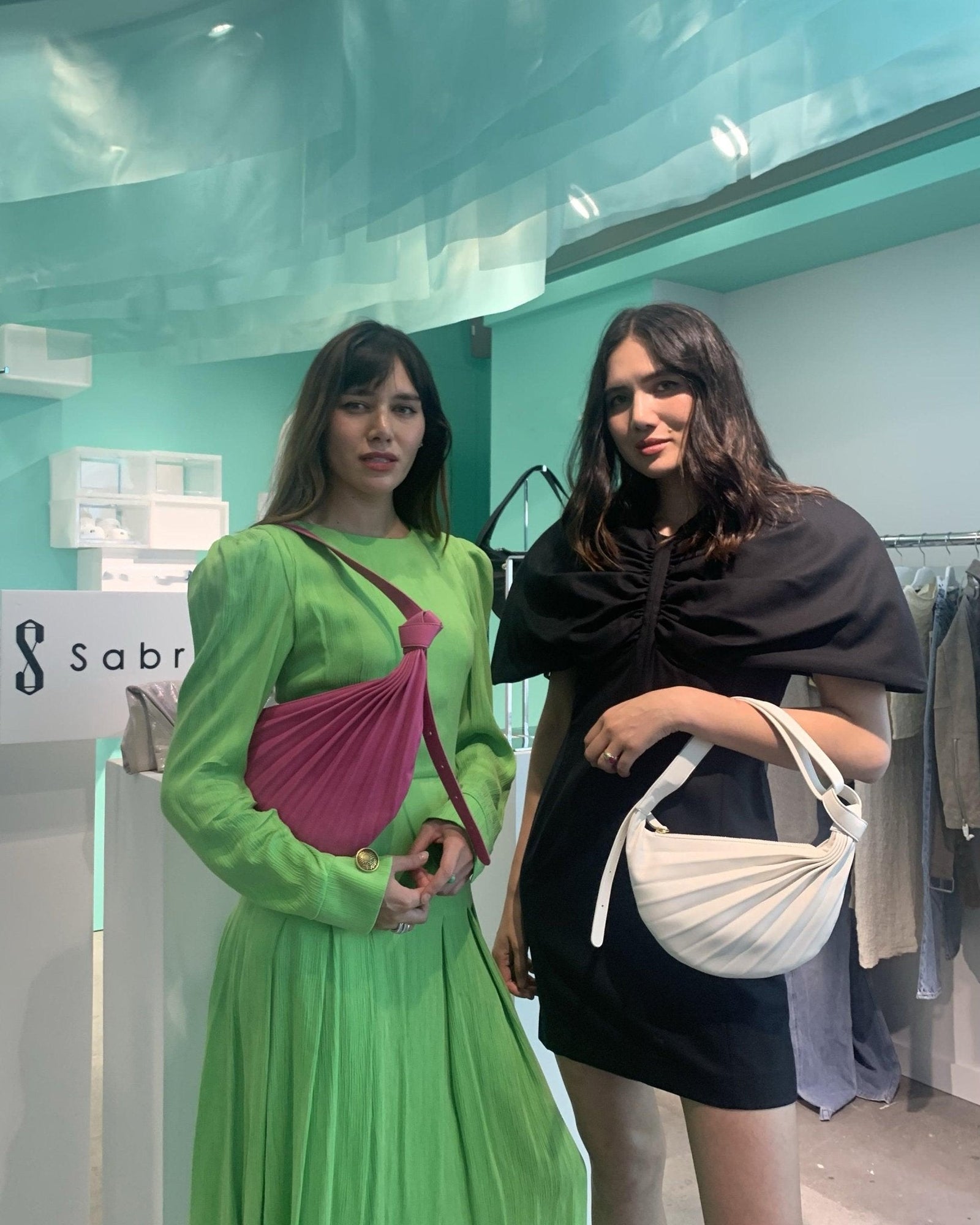 Seen on natalieoffduty- Chiaroscuro Hammock Sling Bag - Sabrina Zeng