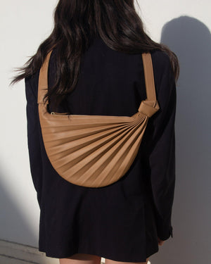 Sabrina Zeng's Chiaroscuro Hammock Sling Bag in Tan - Designer Tan Crossbody Leather Bag